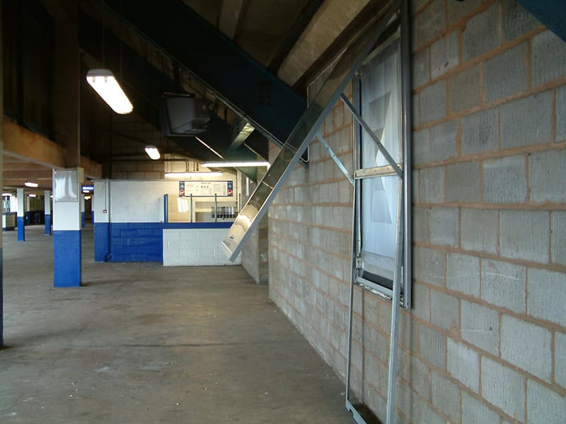 Electrical wiring and conduit installation at a football stadium.