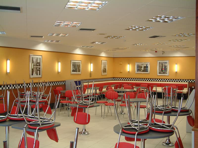 Empty Burger King restaurant in Bristol with stacked chairs and tables.
