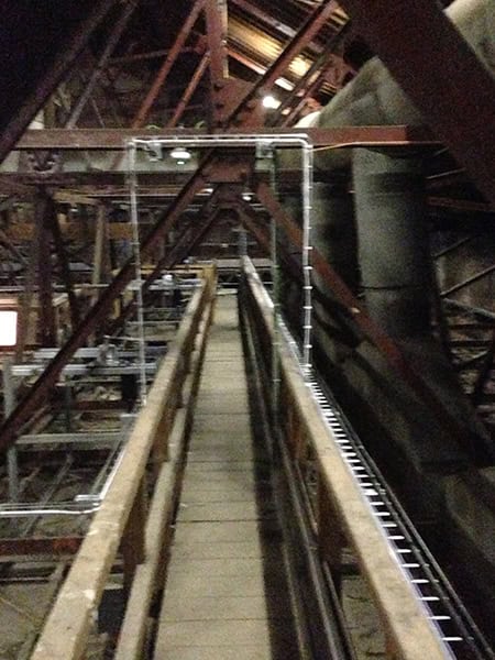 Electrical conduit setup for enhanced safety and organization in historic venue.