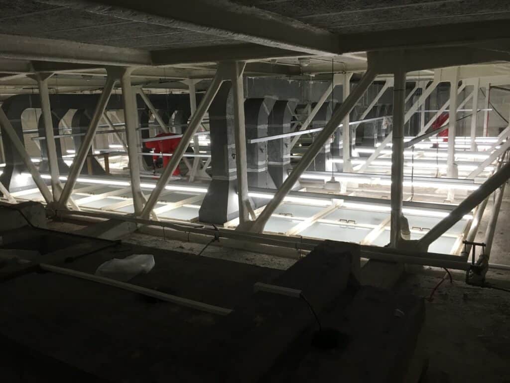 LED lighting installation in parking garage for improved energy efficiency and visibility.